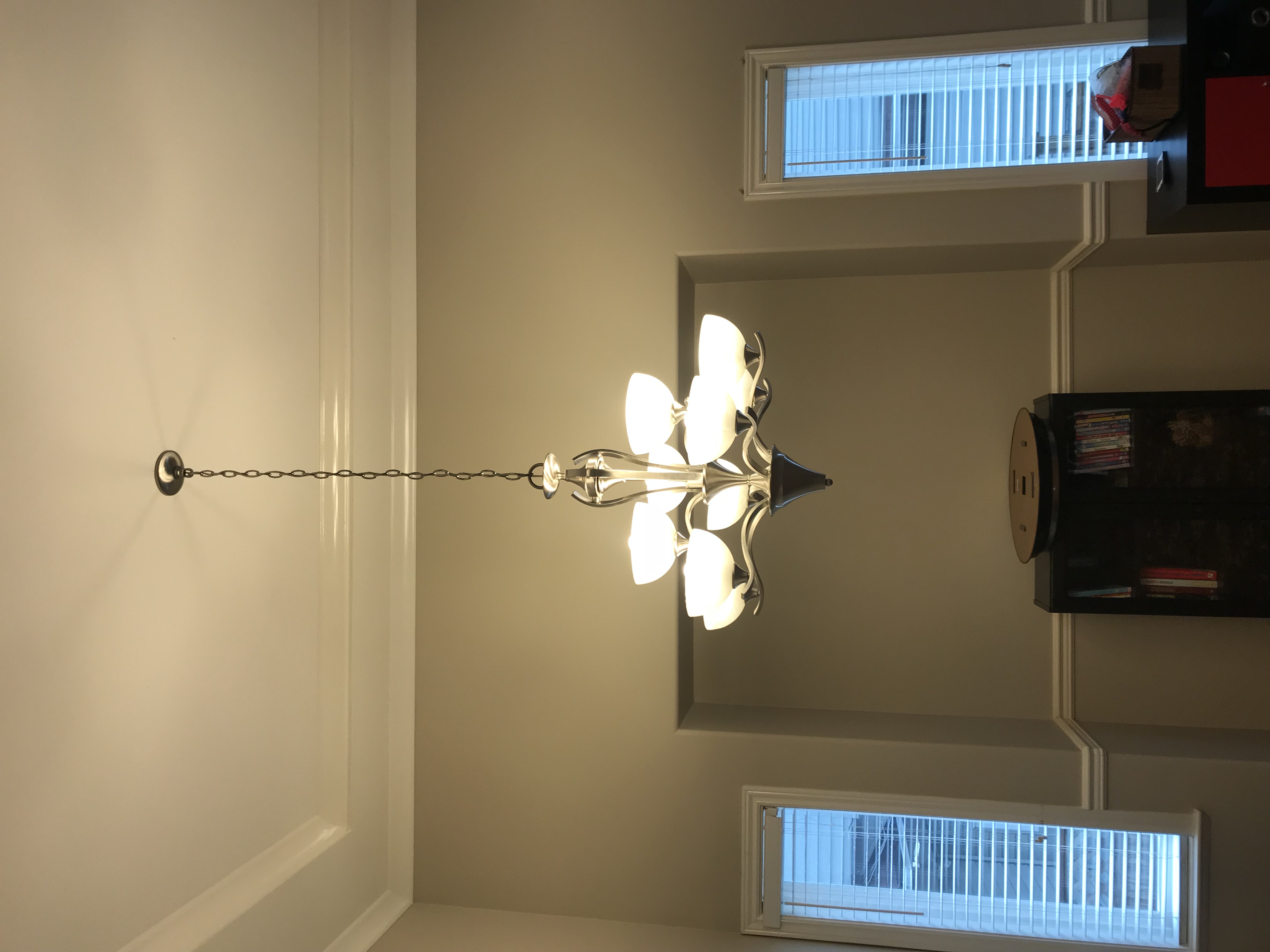 Chandelier installation in dining room
