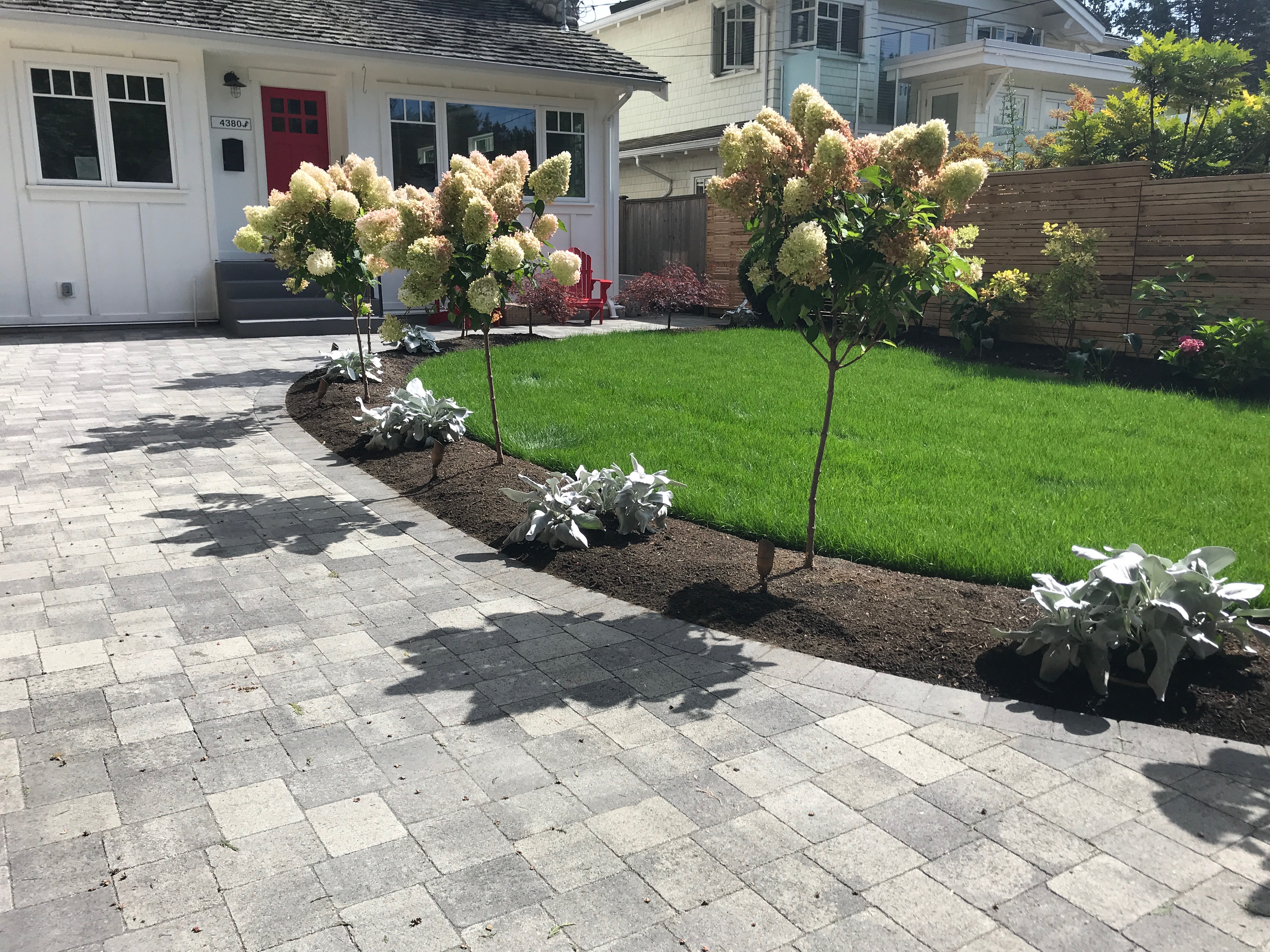 Front yard landscape lighting at dusk