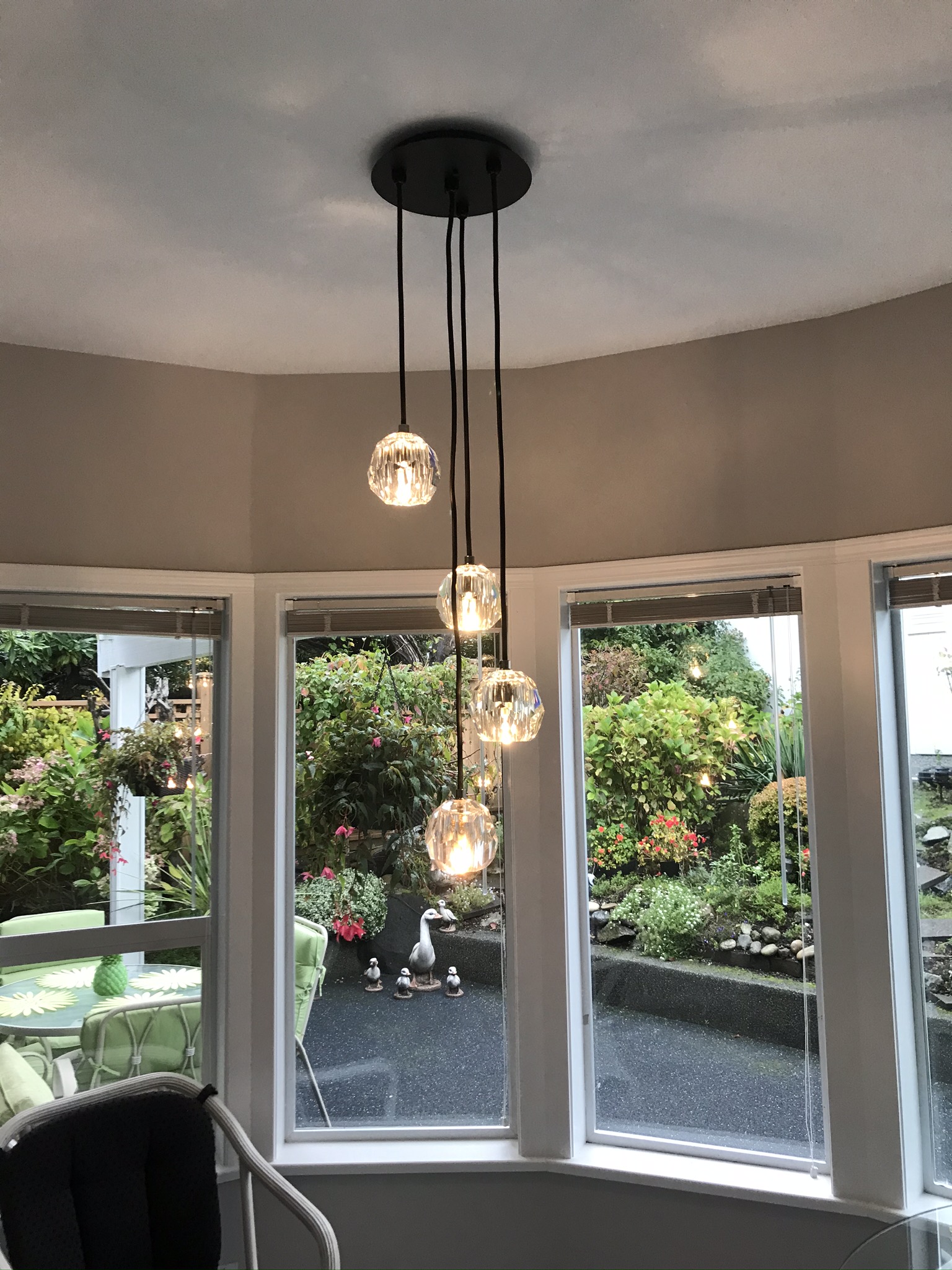 Crystal and glass globe pendant cluster in bay window nook