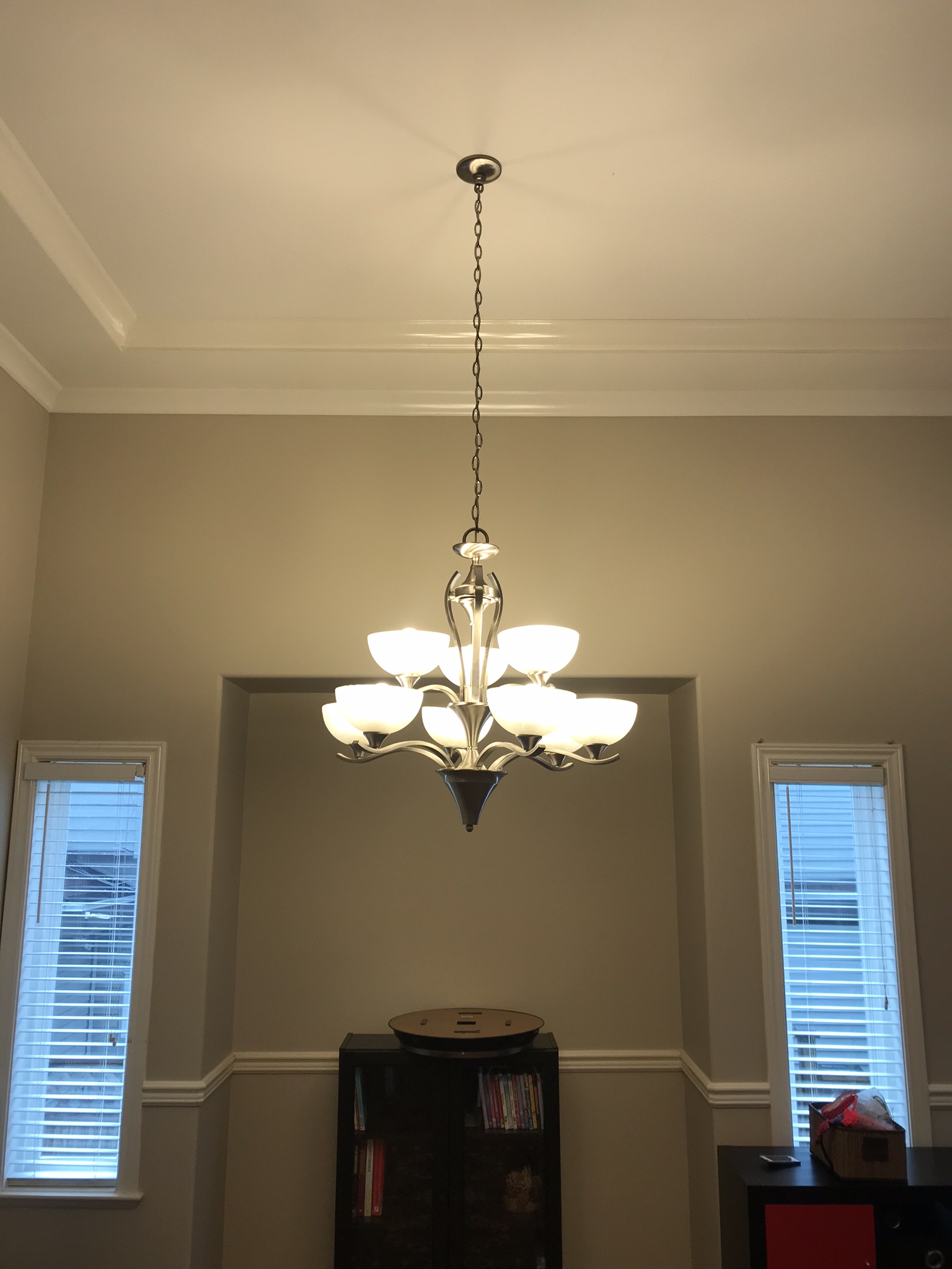 Large traditional chandelier in high-ceiling foyer