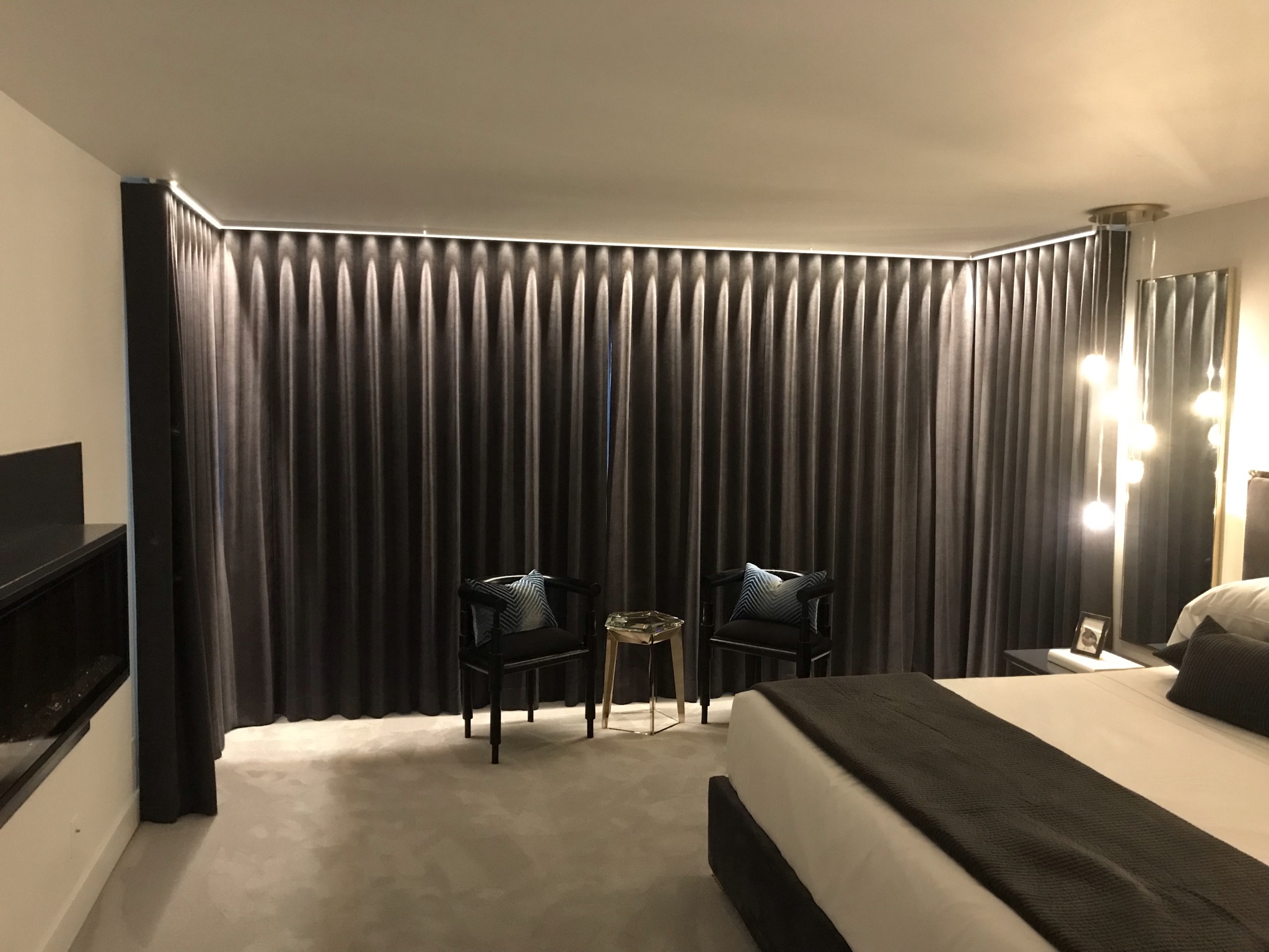 Custom LED cove lighting in luxury master suite